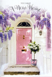 The photograph shows an inviting Kingston Vale front door turned into a serene floral vignette, perfectly suited to mark the joy of moving in. At its heart is a pale pink door, painted in a soothing, almost chalky tone that seems to glow gently against the surrounding whitewashed walls. The simple architecture allows the colour to stand out, radiating a sense of warmth and welcome familiar to the quiet streets close to Richmond Park. Overhead, generous garlands of wisteria sweep down in tumbling curtains of lavender and lilac, their clustered blooms forming soft arcs that frame the doorway. The blossoms look delicate yet abundant, as though they release a subtle, sweet fragrance that drifts along the step. On the threshold rests a vintage-style grey bucket, thoughtfully placed as if just delivered by a local florist. It is filled to overflowing with plush white and cream roses, each bloom layered in soft, spiralling petals that suggest both luxury and tenderness. Wisps of green foliage weave through the arrangement, adding a natural, garden-fresh ease. A pale pink ribbon encircles the bucket, its satin finish catching the light and unifying the pastel palette from roses to door. Gentle sunlight brushes across the scene, creating soft shadows and highlighting textures-the smooth paint of the door, the slightly rough wall, the velvety petals. The overall mood is hopeful and intimate, evoking the quiet thrill of stepping for the first time into a new Kingston Vale home, welcomed not just by a key in the lock, but by flowers that seem to bless the threshold with optimism and good fortune.